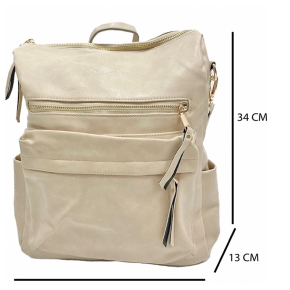 A Girl Thing Handbags - ❤️NEW ARRIVAL cream multi pocket backpack guitar strap